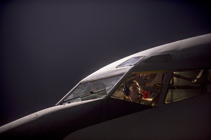 In this Tuesday, Sept. 23, 2014, photo, released by the U.S. Air Force, Maj. Gena Fedoruk, a pilot with the 340th Expeditionary Air Refueling Squadron, pre-flights her aircraft before taking off from a base in the U.S. Central Command area of responsibility in support of a mission conducting airstrikes in Syria. 
