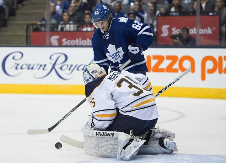 Buffalo Sabres goaltender Andrey Makarov makes a save on Toronto Maple Leafs William Nylander during second period pre-season NHL action in Toronto on SundaySeptember 28, 2014./ THE CANADIAN PRESS/Frank Gunn.