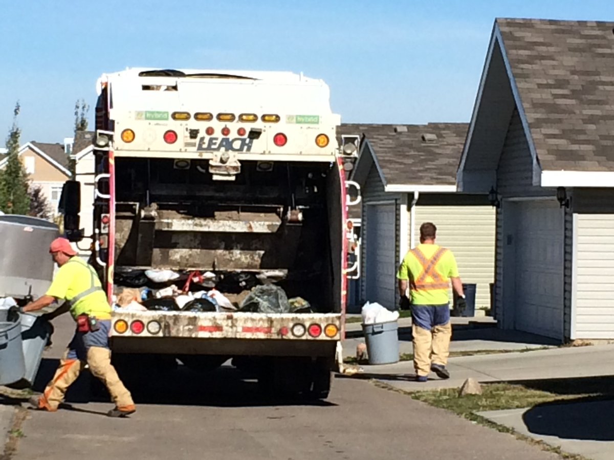 Edmonton waste collectors battle wasps, September 16, 2014.