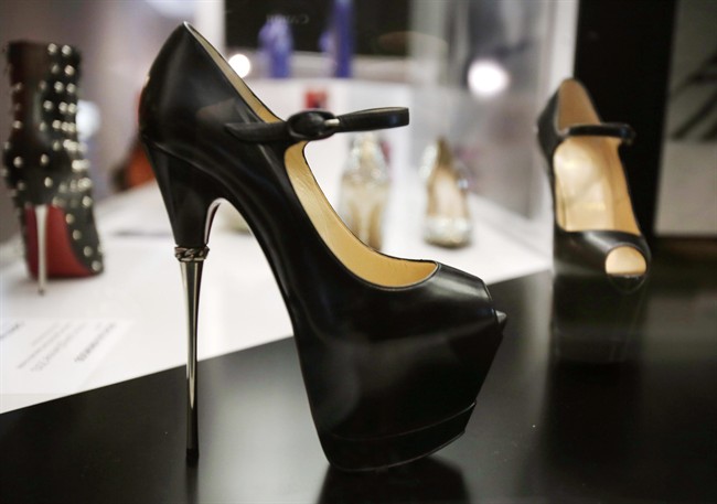 A pair of 2013 Christian Louboutin shoes is on display at an exhibit at the Brooklyn Museum in New York on Sept. 4, 2014.