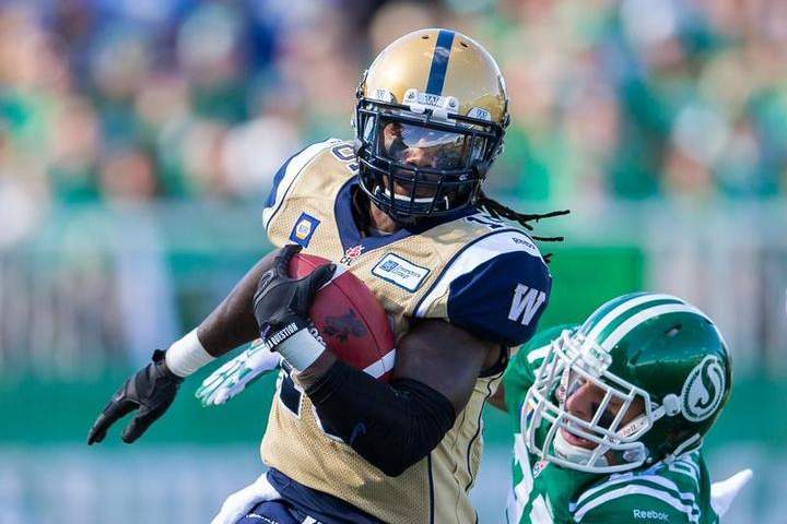 Troy Stoudermire carries the ball for the Winnipeg Blue Bombers during a game against the Saskatchewan Roughriders.