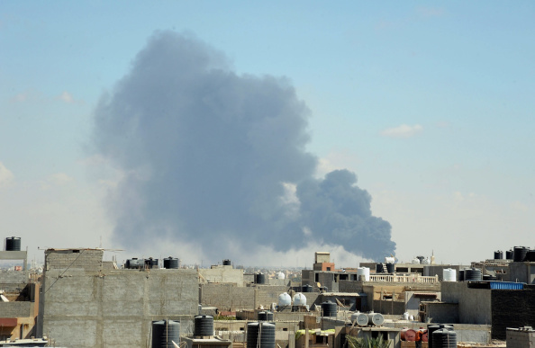 Black smoke rises after the air attacks, staged by forces of major general Khalifa Haftar, in Benghazi, Libya on September 1, 2014. 