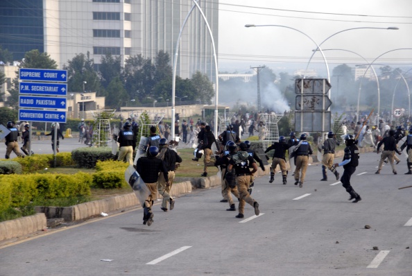 Supporters of Imran Khan and Tahir-ul-Qadri, attack Pakistani security forces during the ongoing anti-government protests in Islamabad. Clashes between the riot police and thousands of anti-government protester continued  which left three people dead and more than 400 wounded.