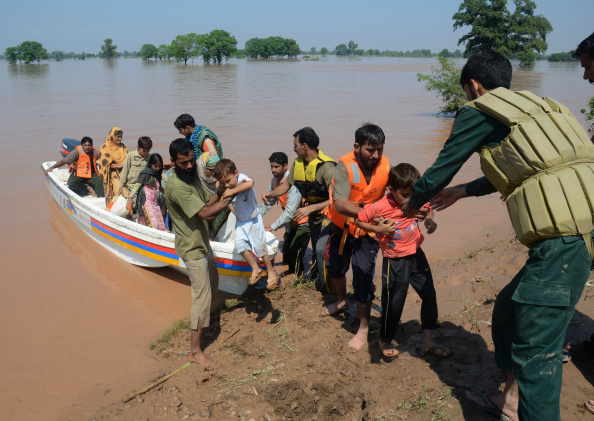Flash flood victims are rescued by volunteers to a safer place. "Heavy monsoon rains and flash floods have killed more than 160 people in Pakistan", officials said. The regions of Punjab and Kashmir are severely affected by the catastrophe that damaged properties, crops and bridges. 