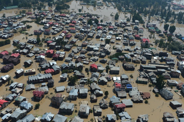 Kashmiri houses submerged by floodwaters are seen from an Indian Air Force helicopter during rescue and relief operations in Srinagar on September 10, 2014. Anger mounted September 10 over the slow pace of rescue operations in Indian Kashmir as authorities said they were "overwhelmed" by the scale of deadly flooding that has left hundreds of thousands of people stranded in India and Pakistan. 