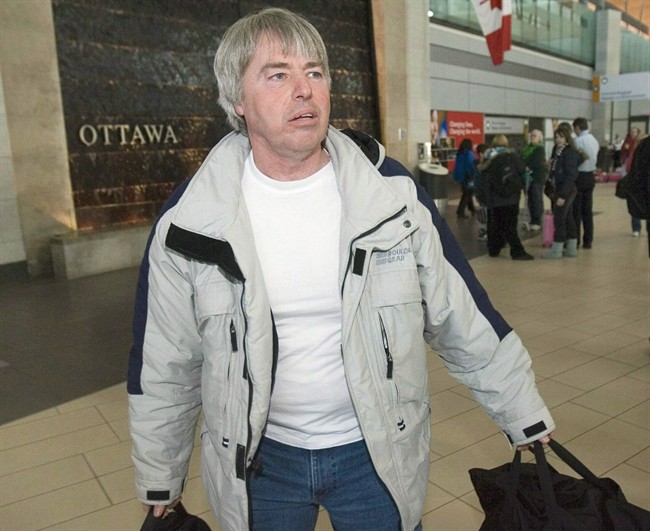 The Parole Board of Canada says it will review a condition that bans Robert Latimer from leaving the country without permission.