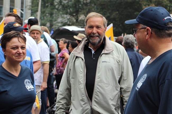 Federal NDP Leader Tom Mulcair greets participants at the annual Labour Day parade in Toronto, Monday, Sept.1, 2014. THE CANADIAN PRESS/Adam Miller.