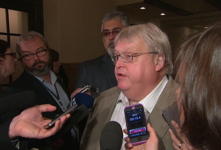 Quebec health minister Gaetan Barrette addresses journalists in Quebec City.
