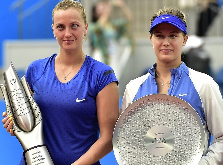Champion Petra Kvitova of the Czech Republic, left, and second place Eugenie Bouchard of Canada pose with their trophies after the final of the Wuhan Open tennis tournament in Wuhan, in China's Hubei province Saturday, Sept. 27, 2014.