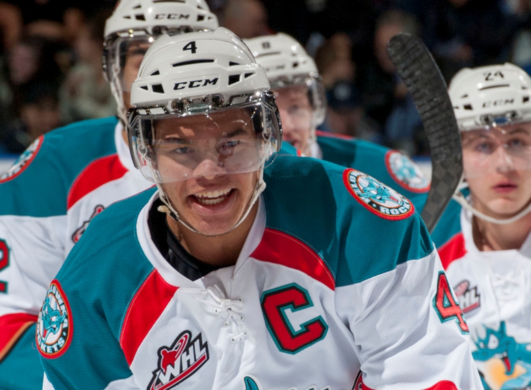 Madison Bowey #4 of the Kelowna Rockets celebrates a goal against the Kamloops Blazers on December 27, 2013 at Prospera Place in Kelowna, British Columbia.