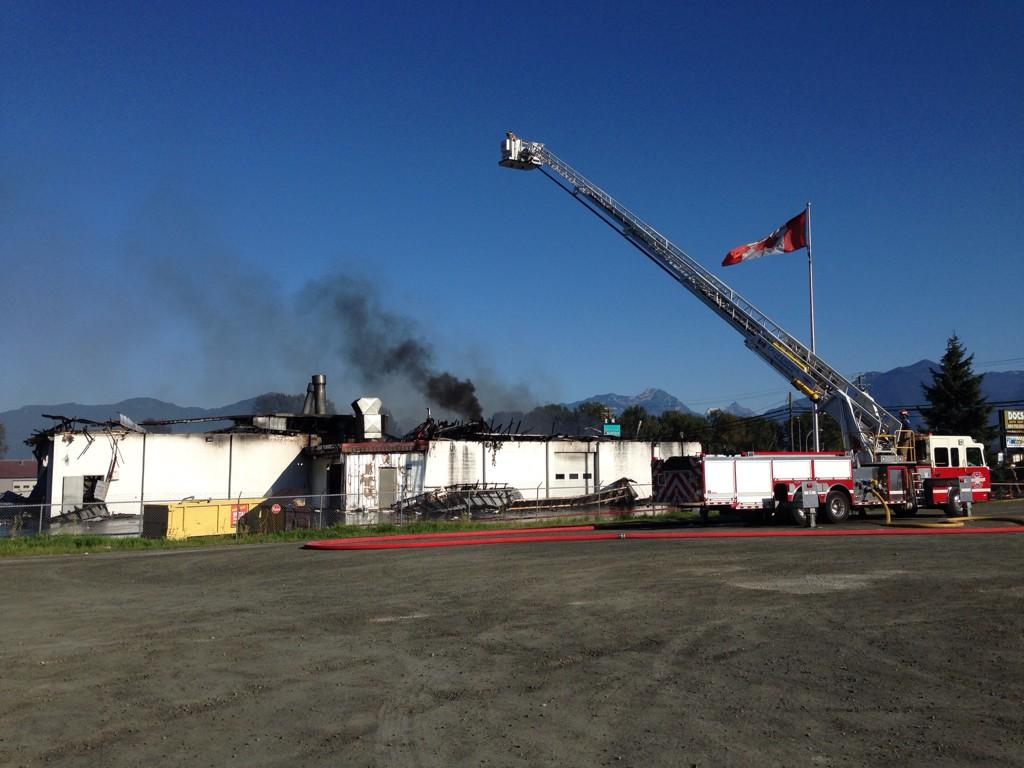 Fire crews respond to fire at Doc's Auto Body in Chilliwack.