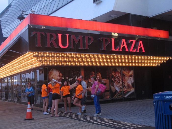 FILE - In this July 24, 2014 file photo, several lights are burned out in the illuminated facade of Trump Plaza Hotel Casino in Atlantic City N.J. Trump Plaza is closing on Tuesday Sept. 16, 2014, the fourth Atlantic City casino to go out of business so far this year.(AP Photo/Wayne Parry, FILE).