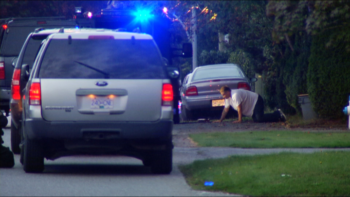 A photo of Aaron James David Douglas as he was arrested during a standoff with Abbotsford police this evening.