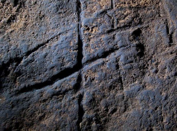 This undated image provided by Journal shows a Neanderthal rock engraving at Gorham’s Cave in Gibraltar. The series of lines scratched into the rock could be proof that Neanderthals were more intelligent and creative than previously thought. (AP Photo/Courtesy of Stuart Finlayson via Journal).