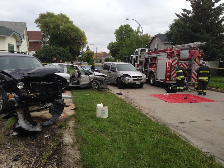 Crashed vehicles on Pacific Ave. W. in Winnipeg on Wednesday, September 17, 2014.