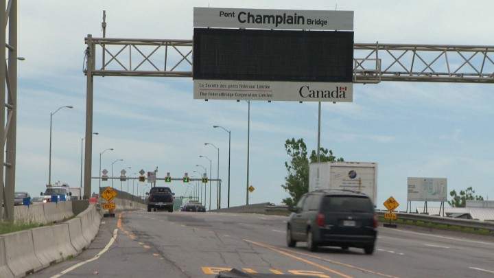 A car heads onto the Champlain Bridge.
