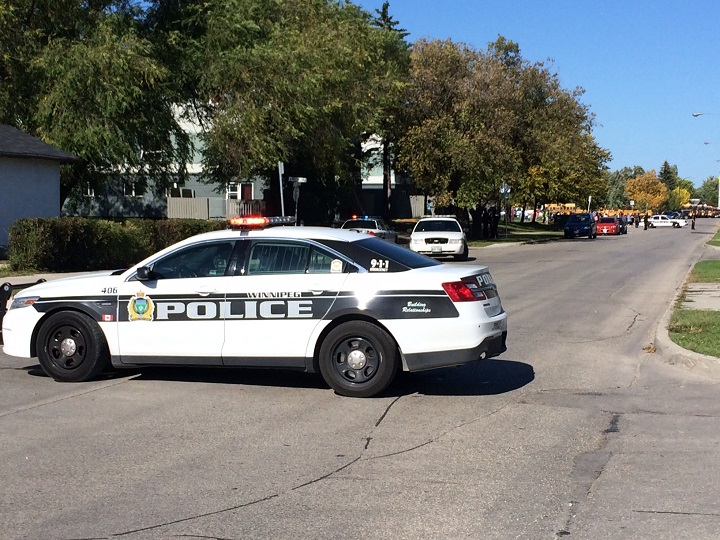 Winnipeg Police block a street near Chief Peguis junior high school at Tuesday, September 23, 2014.