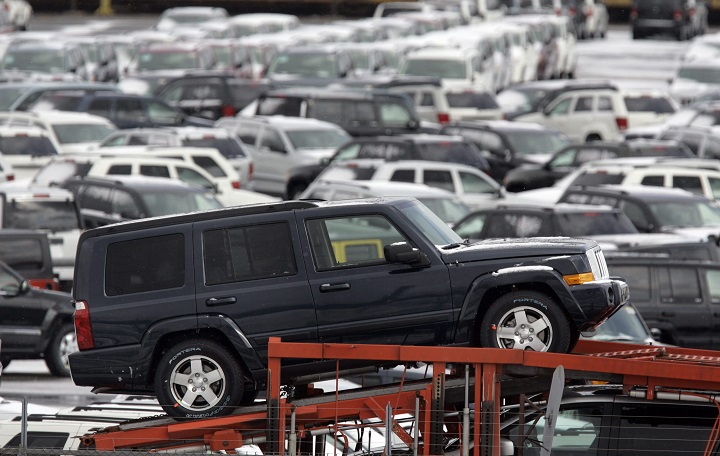 File photo - A Chrysler Jeep Commander is seen on a hauler truck at a holding lot at the Jefferson North Assembly Plant in Detroit, Thursday, Feb. 19, 2009. 