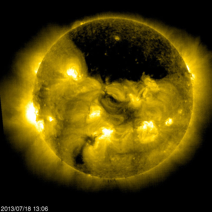 You couldn’t miss this coronal hole if you tried: The dark region at the top of the sun