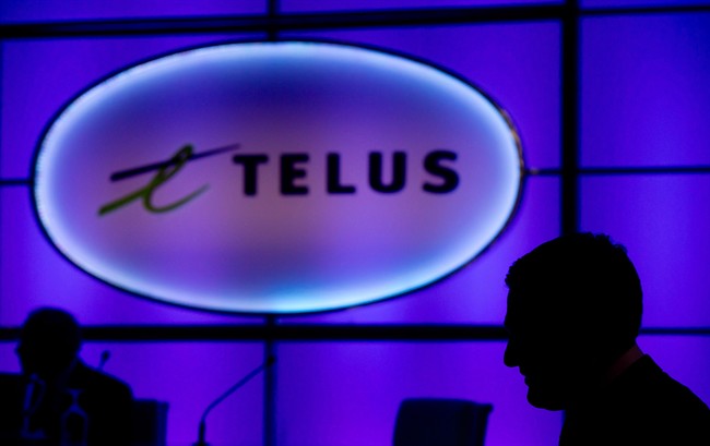 The Telus sign is pictured at company's annual meeting in Vancouver, on May 8, 2014. THE CANADIAN PRESS/Darryl Dyck.
