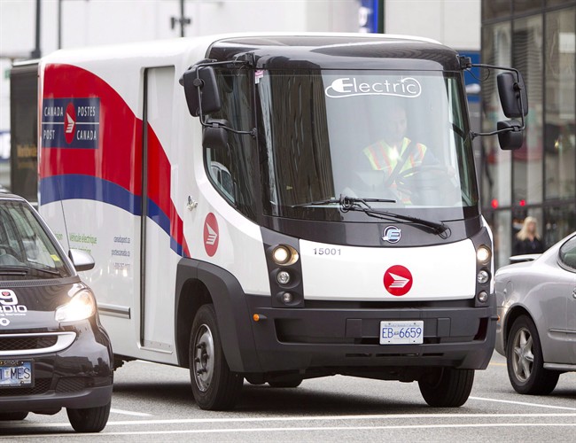 A Canada Post truck makes deliveries in Vancouver on September 21, 2012.