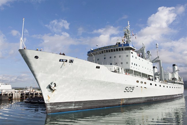 HMCS Protecteur is towed into Joint Base Pearl Harbor-Hickam on March 6, 2014, in Honolulu. 