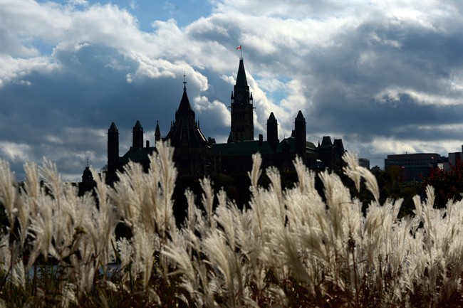 The Parliament Buildings, seen from the Quebec side of the Ottawa River, in 2013.