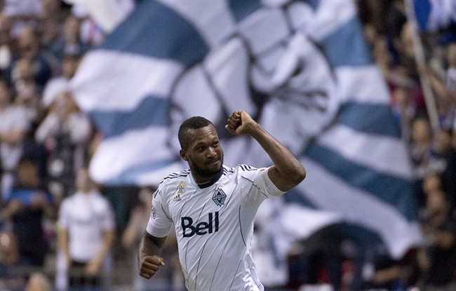FILE PHOTO: Vancouver Whitecaps FC Kendall Waston celebrates his goal aginst the San Joes Earthquakes in Vancouver, Wednesday, Sept., 10, 2014. THE CANADIAN PRESS/Jonathan Hayward.