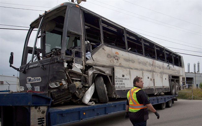 The tour bus that rolled over and crashed on the Coquihalla Highway south of Merritt, B.C., is pictured in Kelowna, on Friday August 29, 2014.THE CANADIAN PRESS/Darryl Dyck.