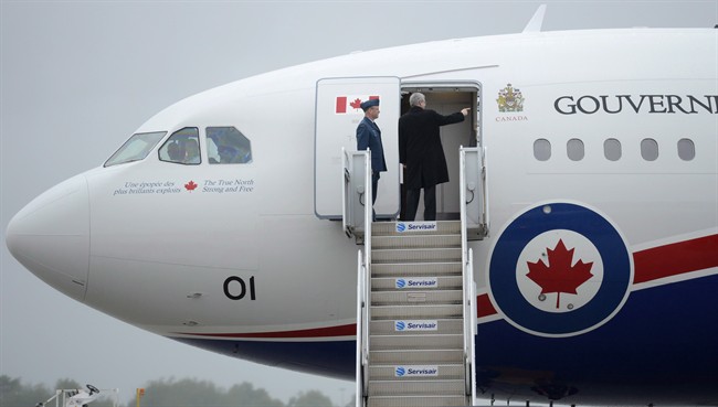 Stephen Harper boards a military Airbus A-310 plane on June 11, 2013 in Ottawa. THE CANADIAN PRESS/Adrian Wyld.
