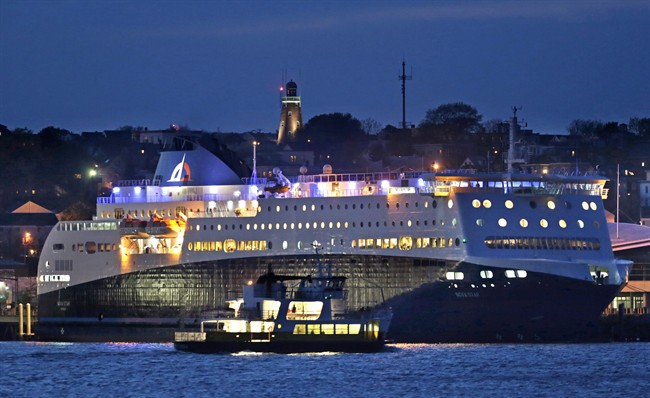 A smaller ferry passes by the Nova Star ferry (rear) as the ship prepares to make its maiden voyage from Portland, Maine to Yarmouth, N.S. on May 15, 2014.