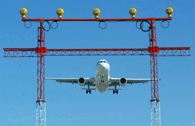 An airliner prepares to land at Pearson International Airport.