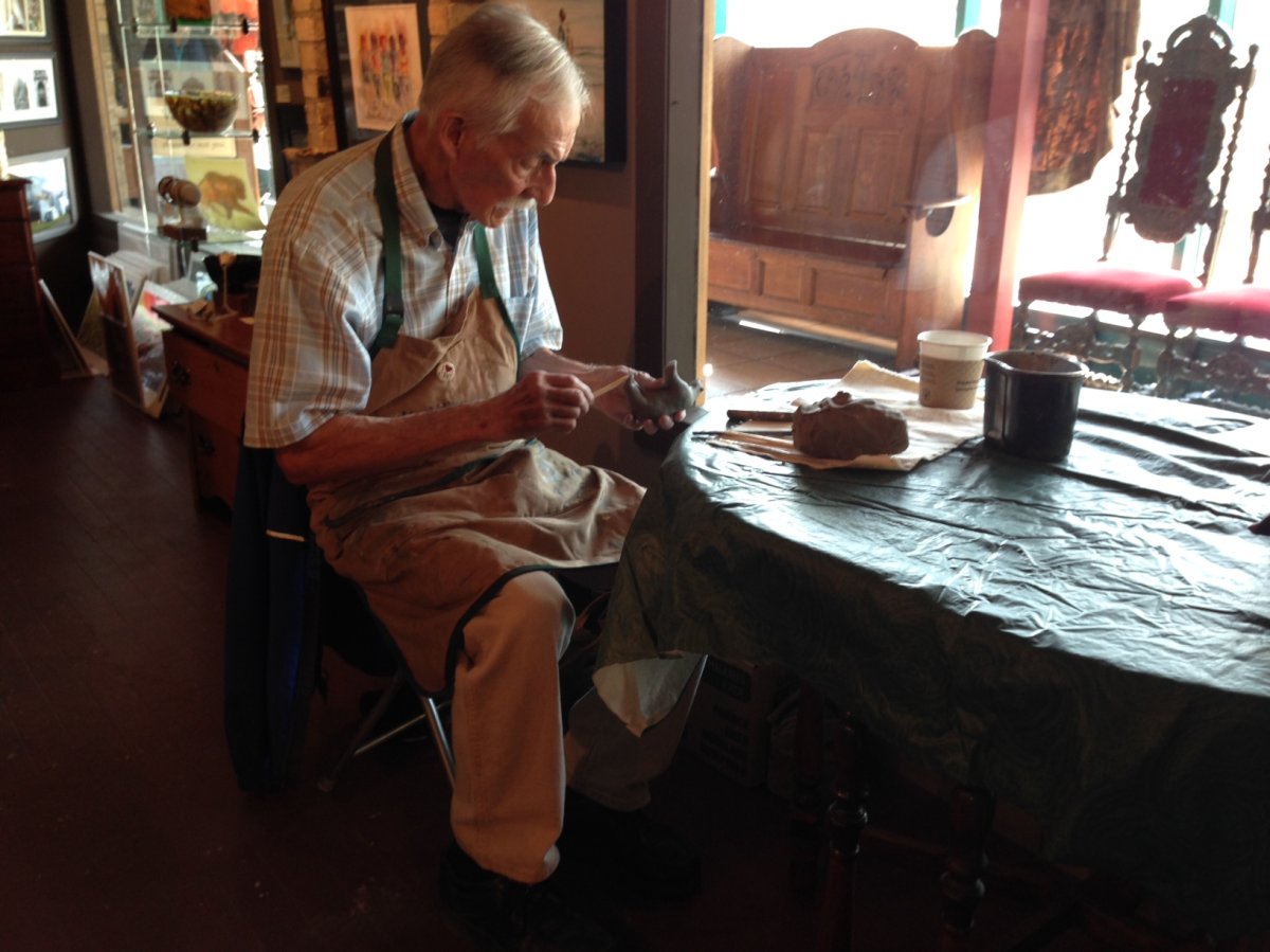 An artist sculpts at a gallery participating in Culture Days .