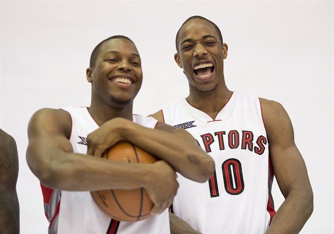 Toronto Raptors Kyle Lowry, left, and DeMar DeRozan laugh while posing for photos at the team's media day at the Air Canada Centre in Toronto on Monday, September 29, 2014. 