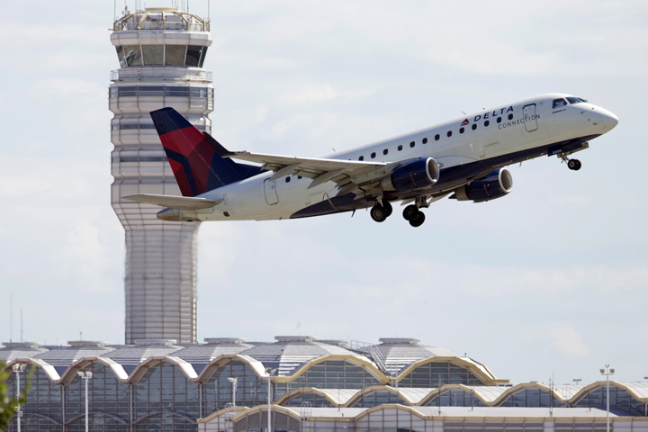 A Delta Air Lines jet takes off from Ronald Reagan Washington National Airport in Arlington, Va., Monday, July 28, 2014. 