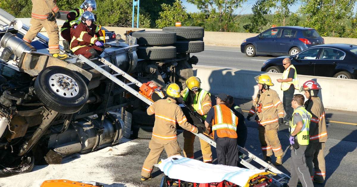Traffic was at a standstill in Longueuil on after a 53-foot transport truck flipped over on September 9, 2014.