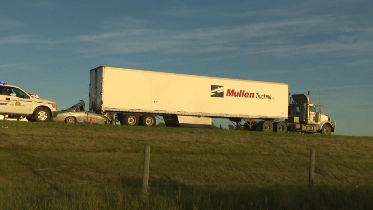 RCMP investigate a fatal collision south of Bowden that killed two people Sunday.