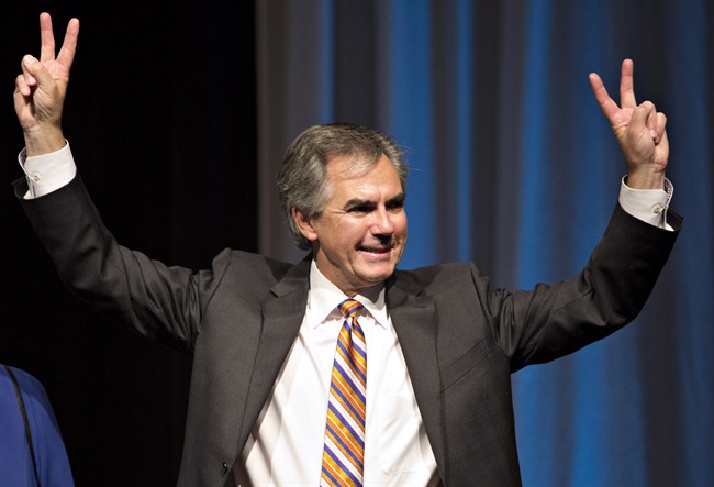 Jim Prentice celebrates his win following the results of the Progressive Conservative leadership first ballot in Edmonton on Saturday, Sept. 6, 2014. THE CANADIAN PRESS/Jason Franson.