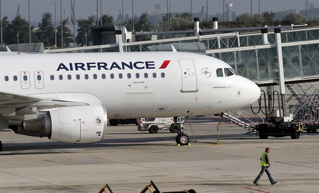 An Air France plane is parked on the tarmac at Paris Charles de Gaulle Airport in Roissy, near Paris, Monday, Sept. 15, 2014. 