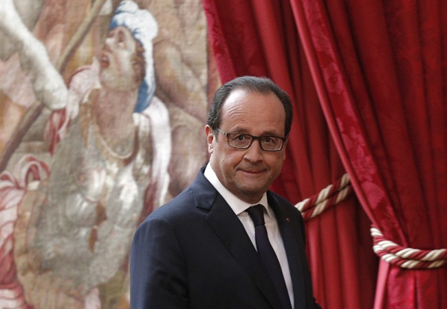 French President Francois Hollande arrives for a press conference at the Elysee Palace, in Paris, Friday, Sept. 19, 2014. 