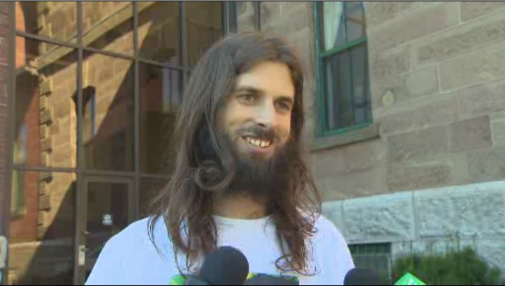 Farm Assists owner Chris Enns speaks to reporters shortly after being released from custody.