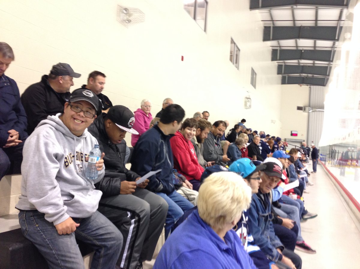 Winnipeg Jets fans watching training camp at MTS Iceplex, looking forward to the upcoming season.