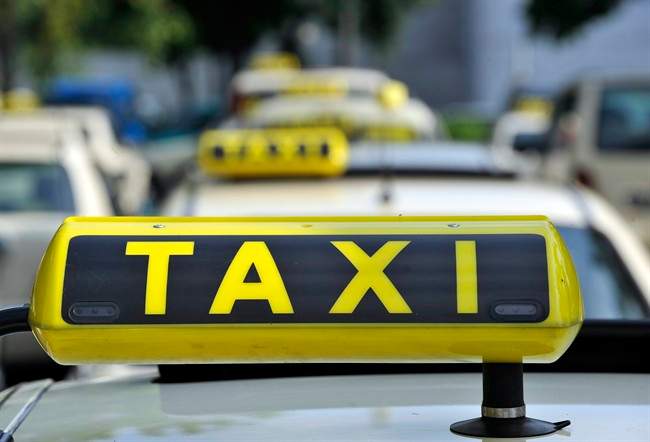FILE - In this June 15, 2009 file photo taxi cabs are seen at Tegel Airport in Berlin.