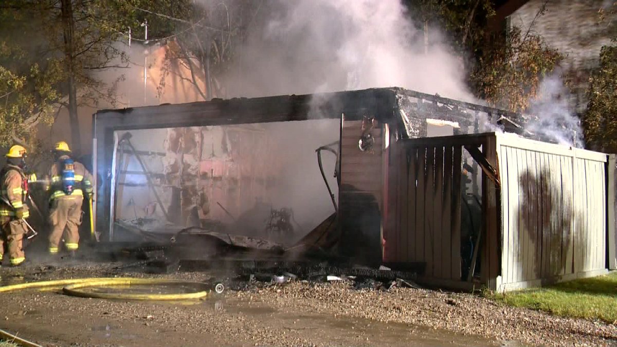 Crews stop garage fire from spreading to northwest home.