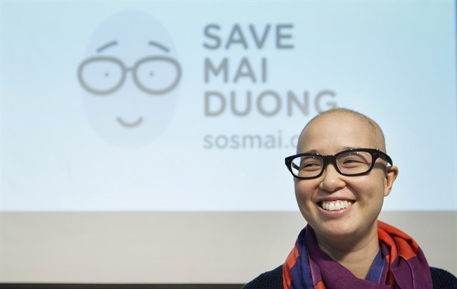 Mai Duong smiles following a news conference in Montreal, Tuesday, September 16, 2014.