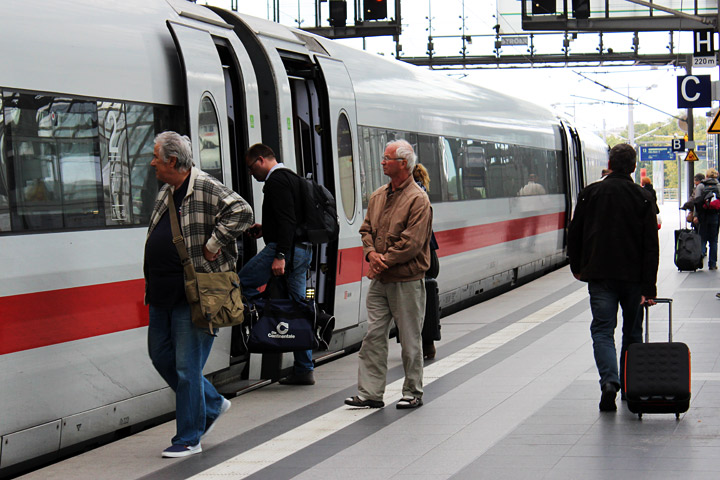 Passengers board a train from Berlin to Cologne.
