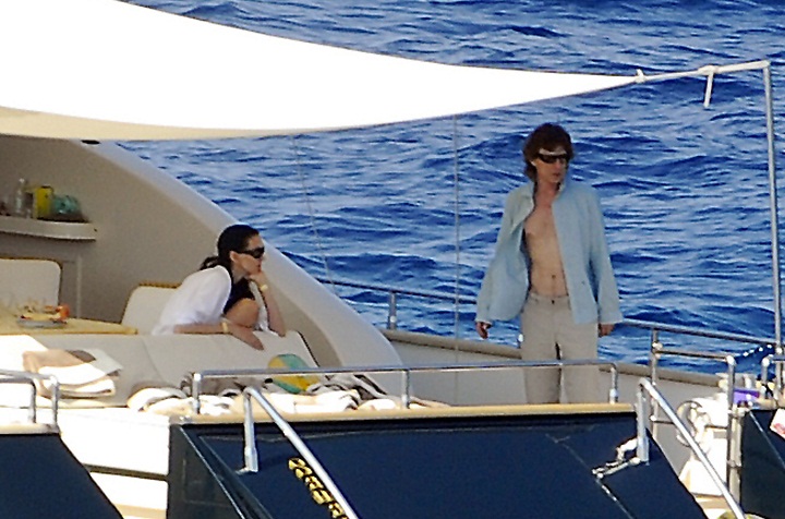No stranger to yachts, Mick Jagger is pictured here with fashion designer L'Wren Scott board a private yacht on August 13, 2009 in Tuscany, Italy. 