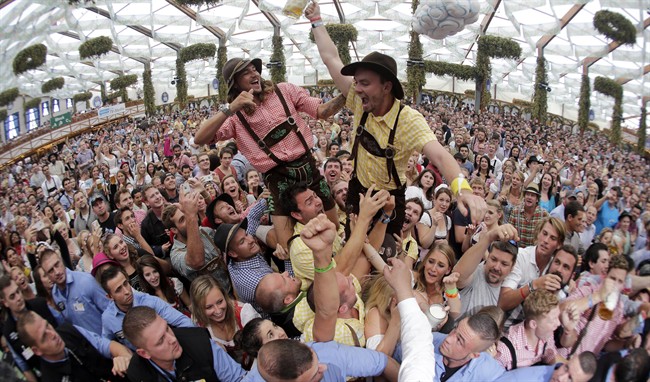 People celebrate the opening of the 181th Oktoberfest beer festival in Munich.