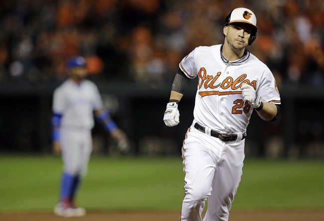 Baltimore Orioles' Steve Pearce rounds the bases after hitting a three-run home run in the first inning of a baseball game against the Toronto Blue Jays, Tuesday, Sept. 16, 2014, in Baltimore. (AP Photo/Patrick Semansky).