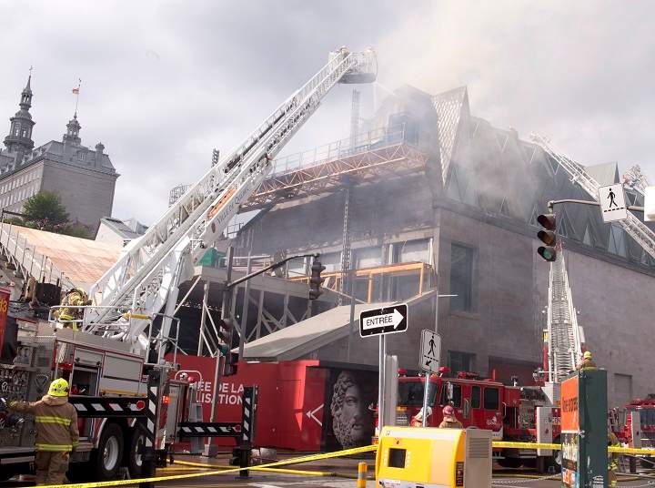 Firefighters battle a four-alarm fire at Quebec’s Museum of Civilization, Monday, September 15, 2014 in Quebec City.